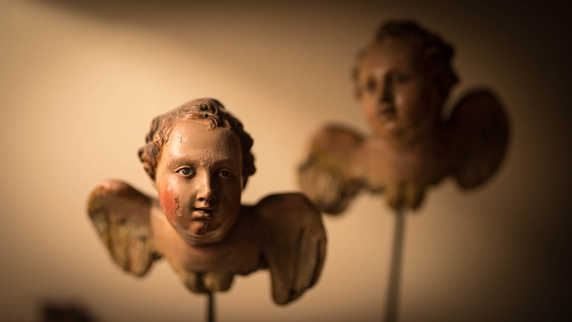 Two Italian cherubs with moody lighting